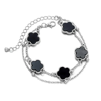 Silver chain wrist chain with five black clover asta charm outlines in polished metallic on black clover asta bracelet