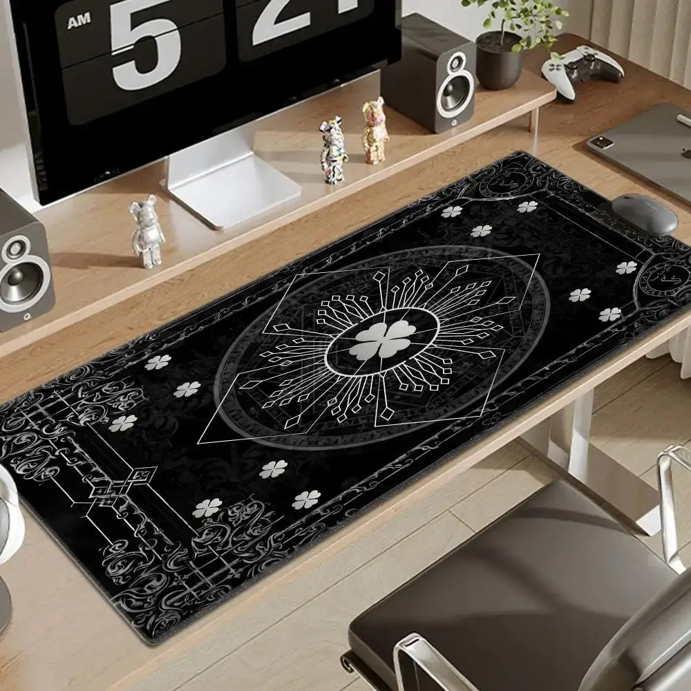 Black clover asta gaming desk mat with intricate white geometric and floral patterns on a black surface