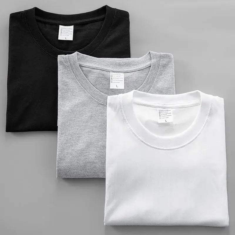 Three neatly folded black clover asta graphic crew neck tees in black heather gray and white cotton oversized fit