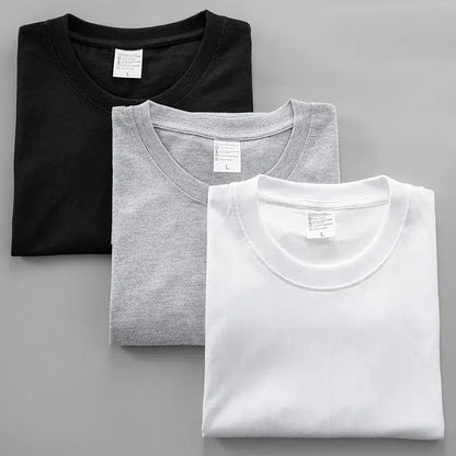 Three neatly folded black clover asta graphic crew neck tees in black heather gray and white cotton oversized fit