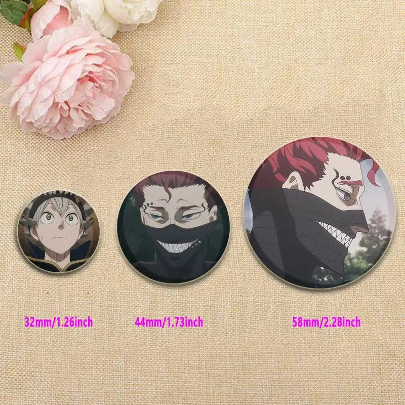 Three glossy circular black clover asta lapel pins in varying sizes featuring detailed anime character illustrations