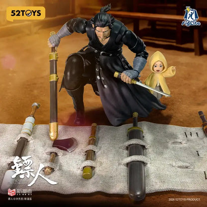 Black armored guardians daoma action figure and yellow hooded child posed dynamically on textured cloth surface