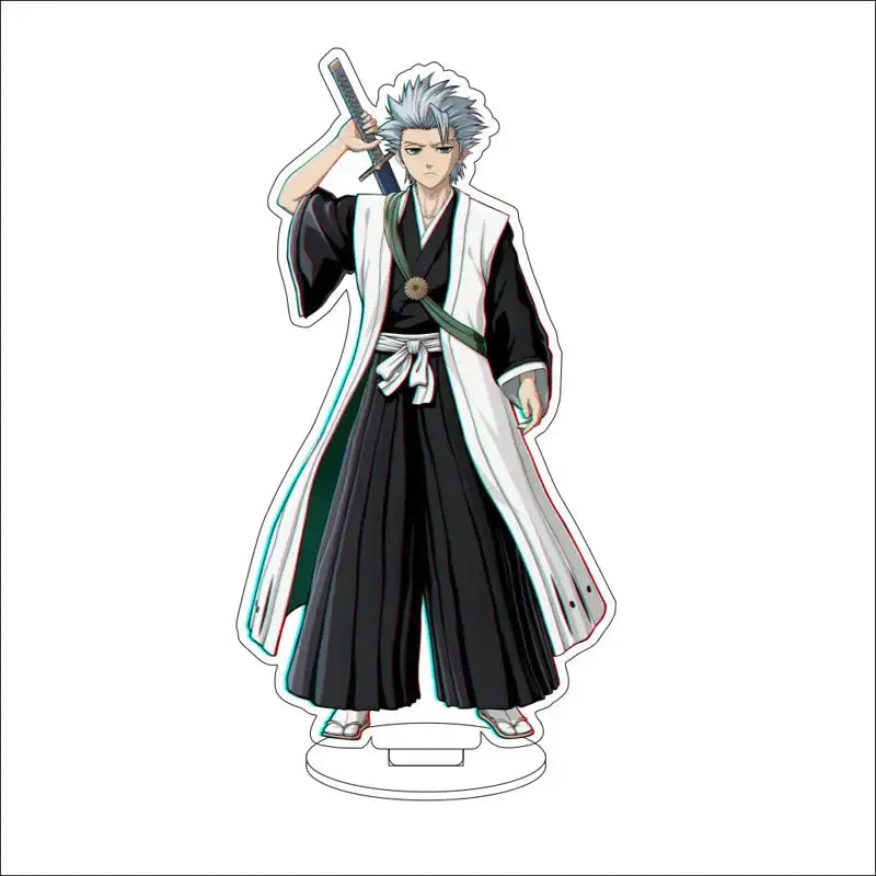 Bleach character acrylic standee featuring silver-haired anime figure in black and white robe with green sash on clear base