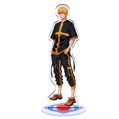 Clear acrylic standee set featuring a spiky orange-haired anime character in black and yellow outfit from bleach