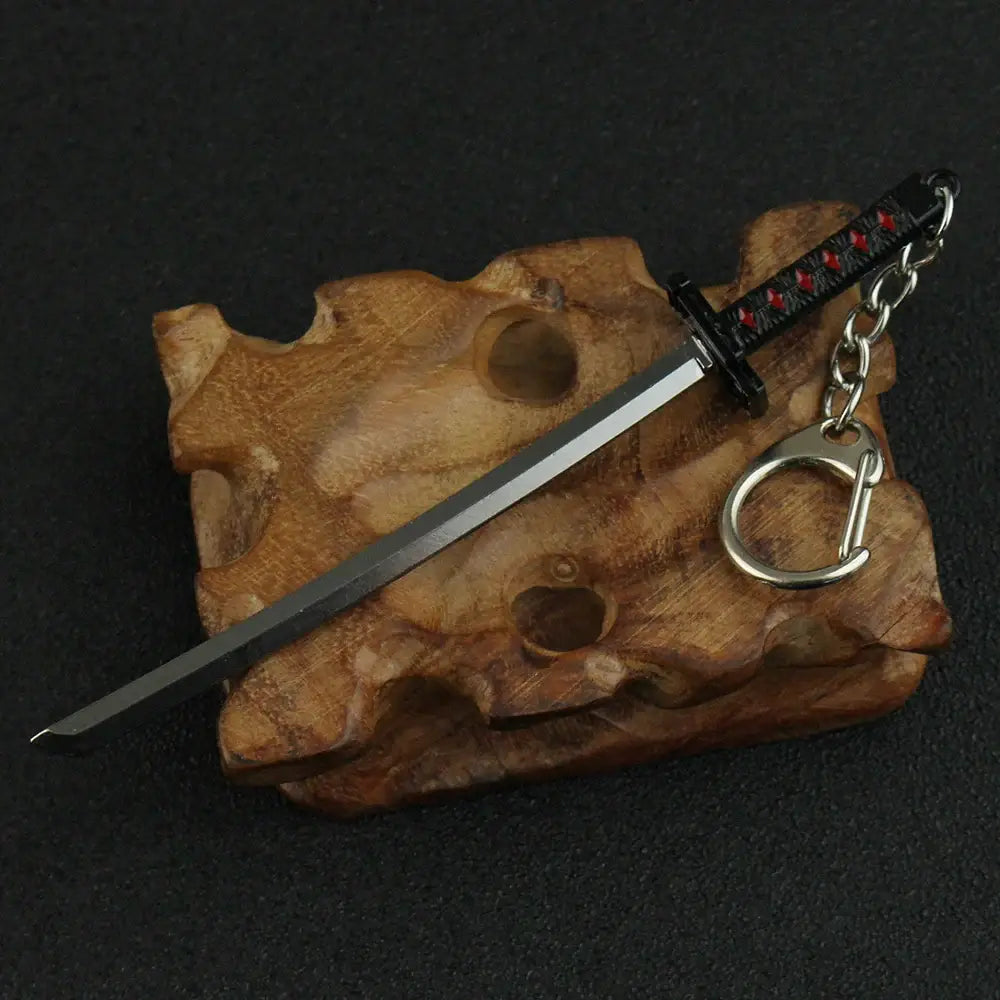Bleach hitsugaya toushirou sword keychain with silver blade and ornate black and red zinc alloy hilt design
