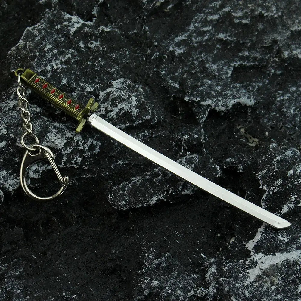 Bleach hitsugaya toushirou sword keychain with silver blade and ornate gold hilt red inlays zinc alloy sword keychain