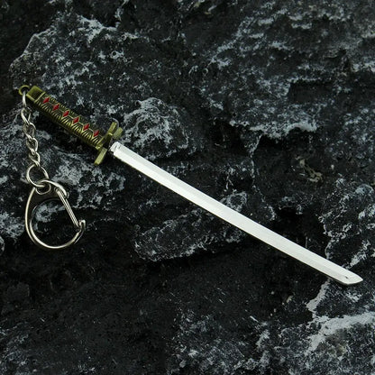 Bleach hitsugaya toushirou sword keychain with silver blade and ornate gold hilt red inlays zinc alloy sword keychain
