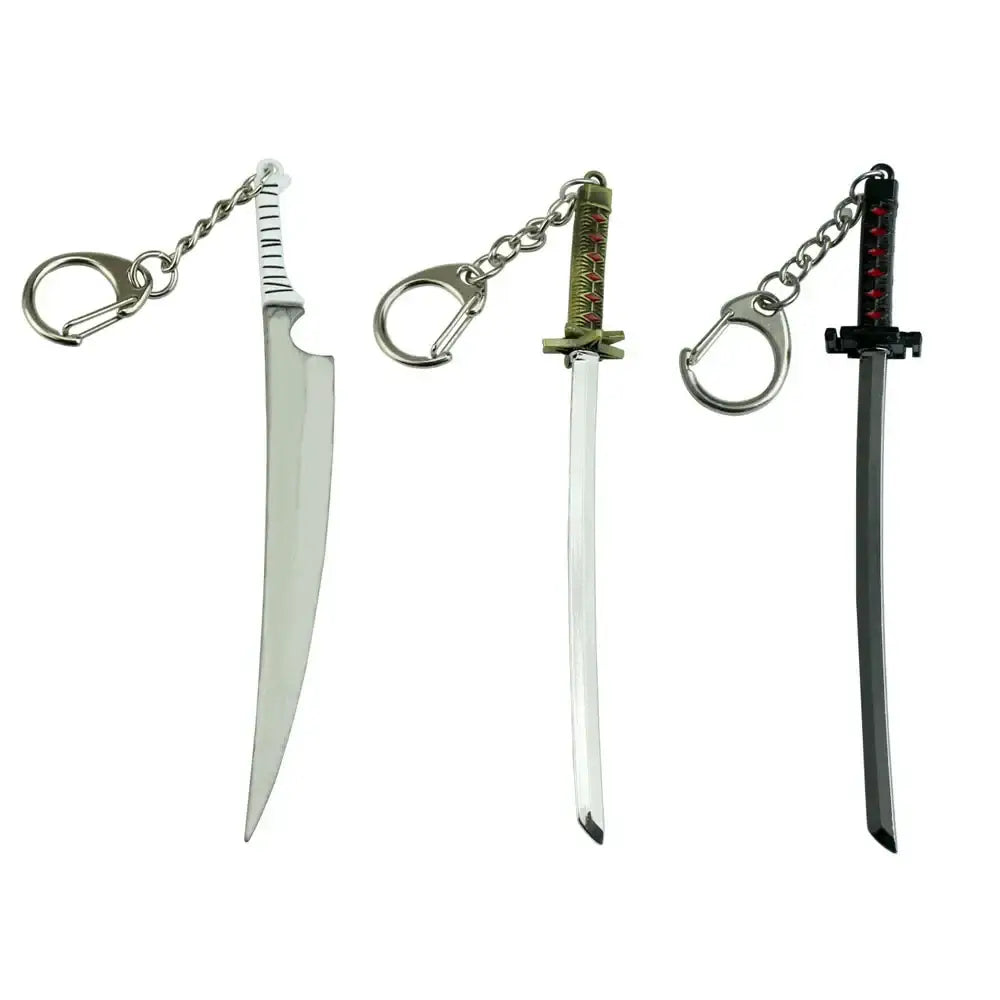 Three metallic zinc alloy sword keychains with distinct blade shapes and handle designs from bleach hitsugaya toushirou collection