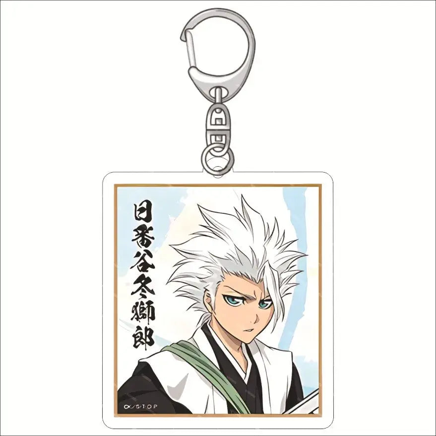 Silver-toned acrylic keychain featuring ichigo kurosaki in white and black shinigami uniform from bleach