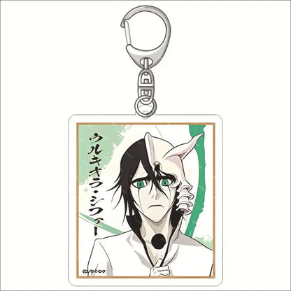 Silver metal acrylic keychain featuring a rectangular charm with ulquiorra cifer illustration from bleach in white uniform