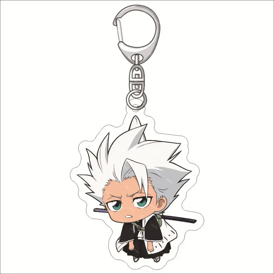 Chibi-style bleach ichigo acrylic keychain featuring a white-haired anime character with green eyes holding a sword
