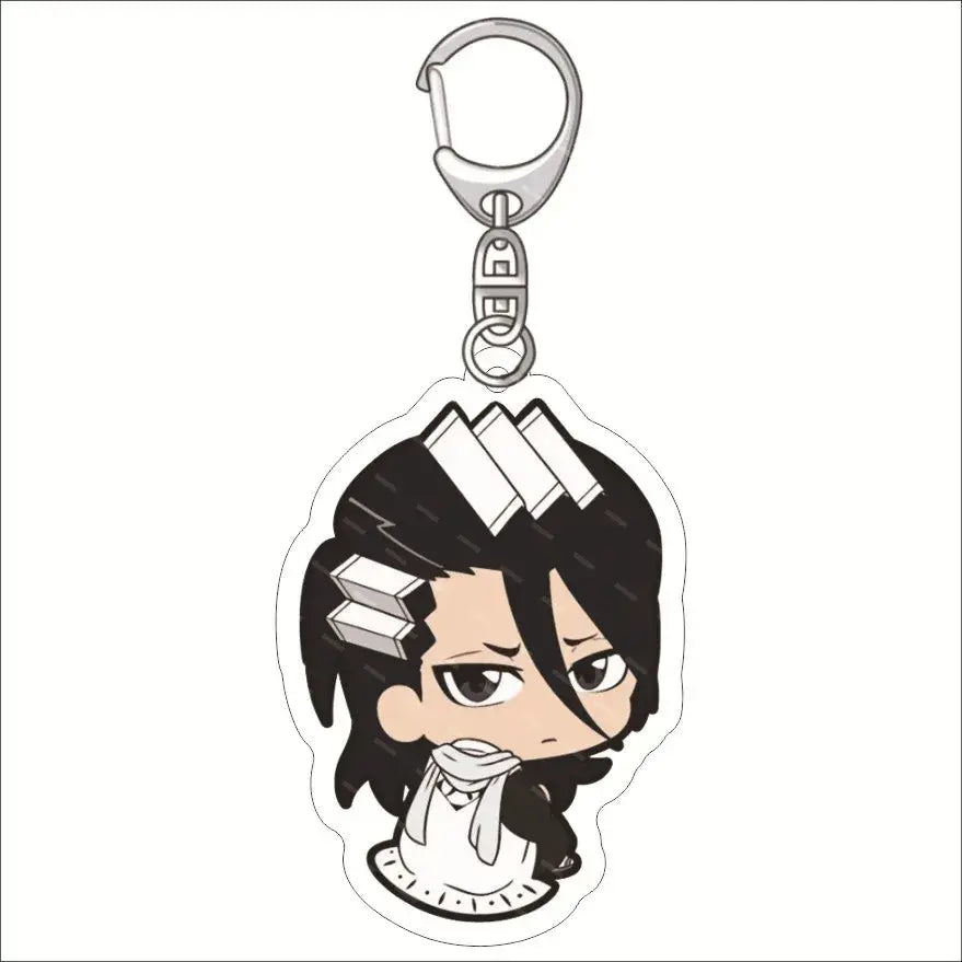 Black and white chibi-style bleach ichigo acrylic keychain with dark hair, three rectangular hair accessories, and scarf