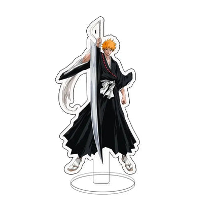 Clear acrylic ichigo acrylic standee featuring spiky orange hair anime character in black robe holding silver sword for desk display