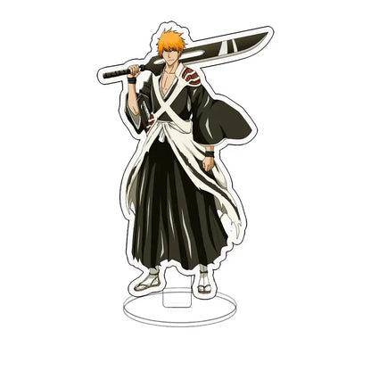 Bleach ichigo acrylic standee featuring black and white shinigami uniform with orange hair and large sword on desk