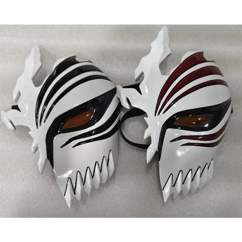 Two white glossy plastic ichigo hollow masks with black and red stripes for bleach cosplay half-face use