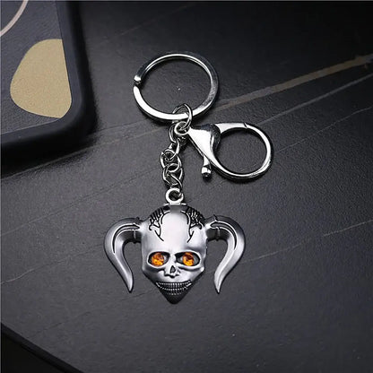 Silver metal ichigo hollow mask keychain with orange gemstone eyes and devil horns for bleach ichigo hollow fans