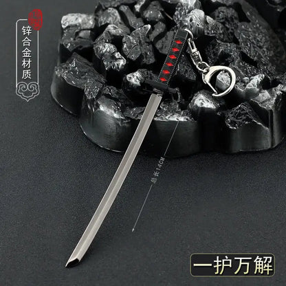 Bleach ichigo hollow mask metal keychain with a sleek silver sword and black handle with red inlays and ring attachment