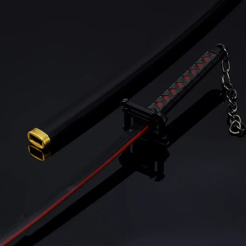 Bleach ichigo katana 25cm metal sword keychain in black and red zinc alloy with gold-accented textured grip and chain