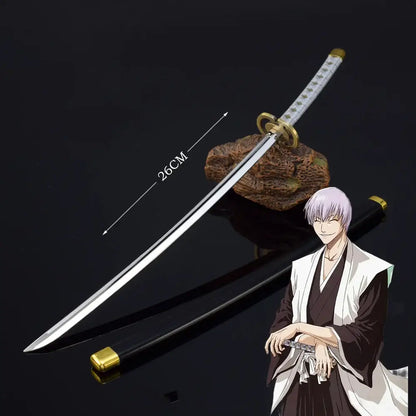 Bleach ichigo katana 25cm metal sword with silver zinc alloy blade gold accents and white textured handle on dark surface