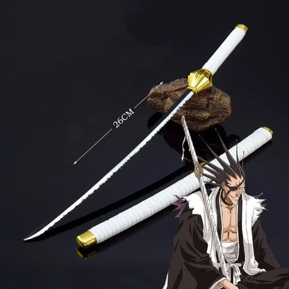 Bleach Ichigo katana 25cm metal sword with white and gold zinc alloy blade and serrated black edge resting on rock