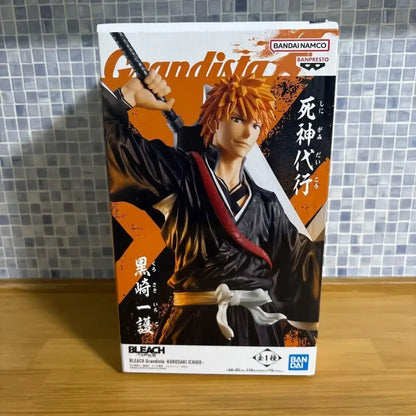 Black and orange ichigo kurosaki grandista pvc figure in traditional japanesestyle robe with red sash by bandai namco