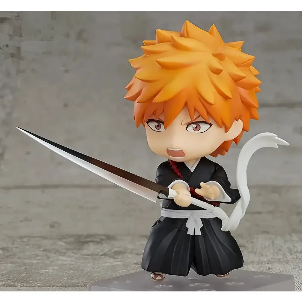 Bleach ichigo kurosaki pvc figure 10cm with orange spiky hair in black white outfit holding silver blade sword boxed