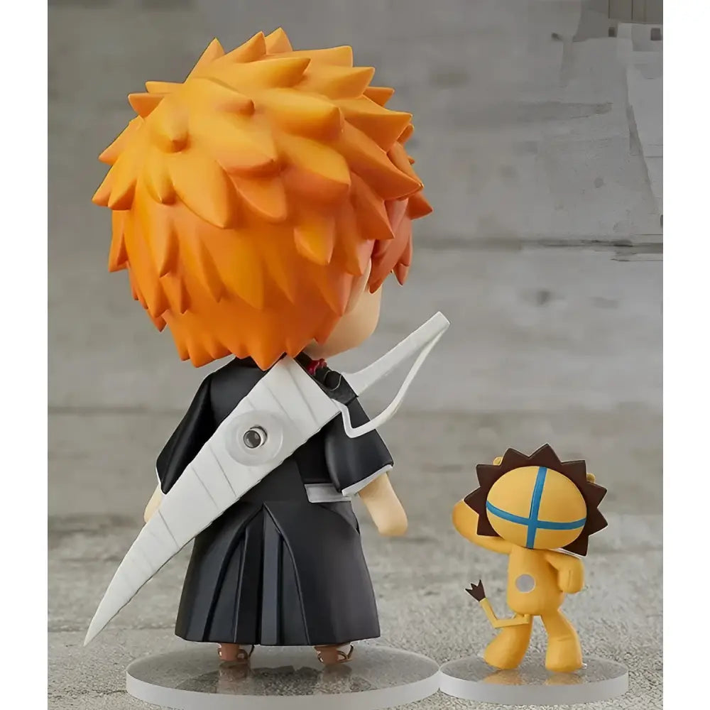 Bleach ichigo kurosaki pvc figure 10cm in black outfit with white sword standing beside yellow lion-like creature