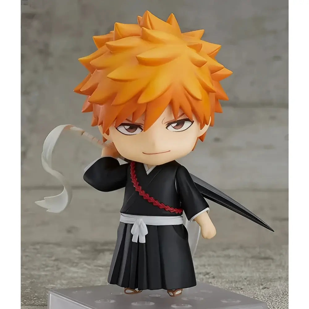 Bleach ichigo kurosaki 10cm pvc figure with orange spiky hair in black traditional outfit holding a sword hilt boxed