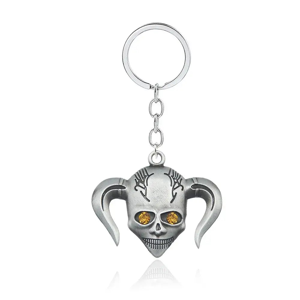 Silver harley quinn skull keychain with orange gemstone eyes and stylized pigtails made of durable zinc alloy for mask necklace cosplay accessory