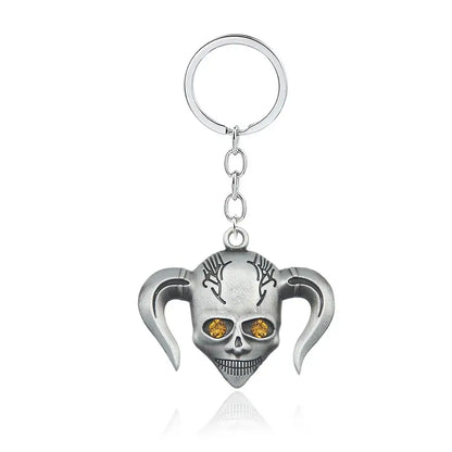Silver harley quinn skull keychain with orange gemstone eyes and stylized pigtails made of durable zinc alloy for mask necklace cosplay accessory