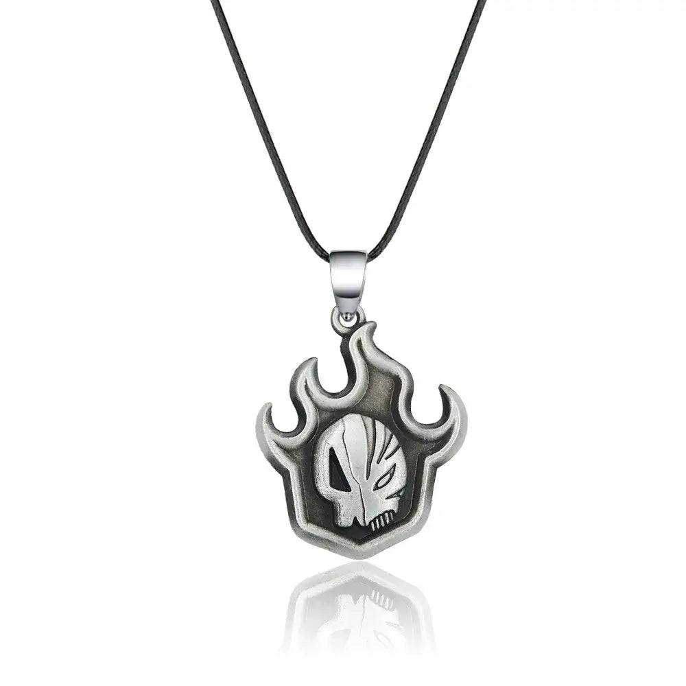 Silver-toned bleach ichigo mask necklace with flame design and embossed skull emblem made of durable zinc alloy on black cord