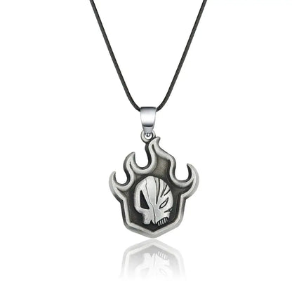 Silver-toned bleach ichigo mask necklace with flame design and embossed skull emblem made of durable zinc alloy on black cord