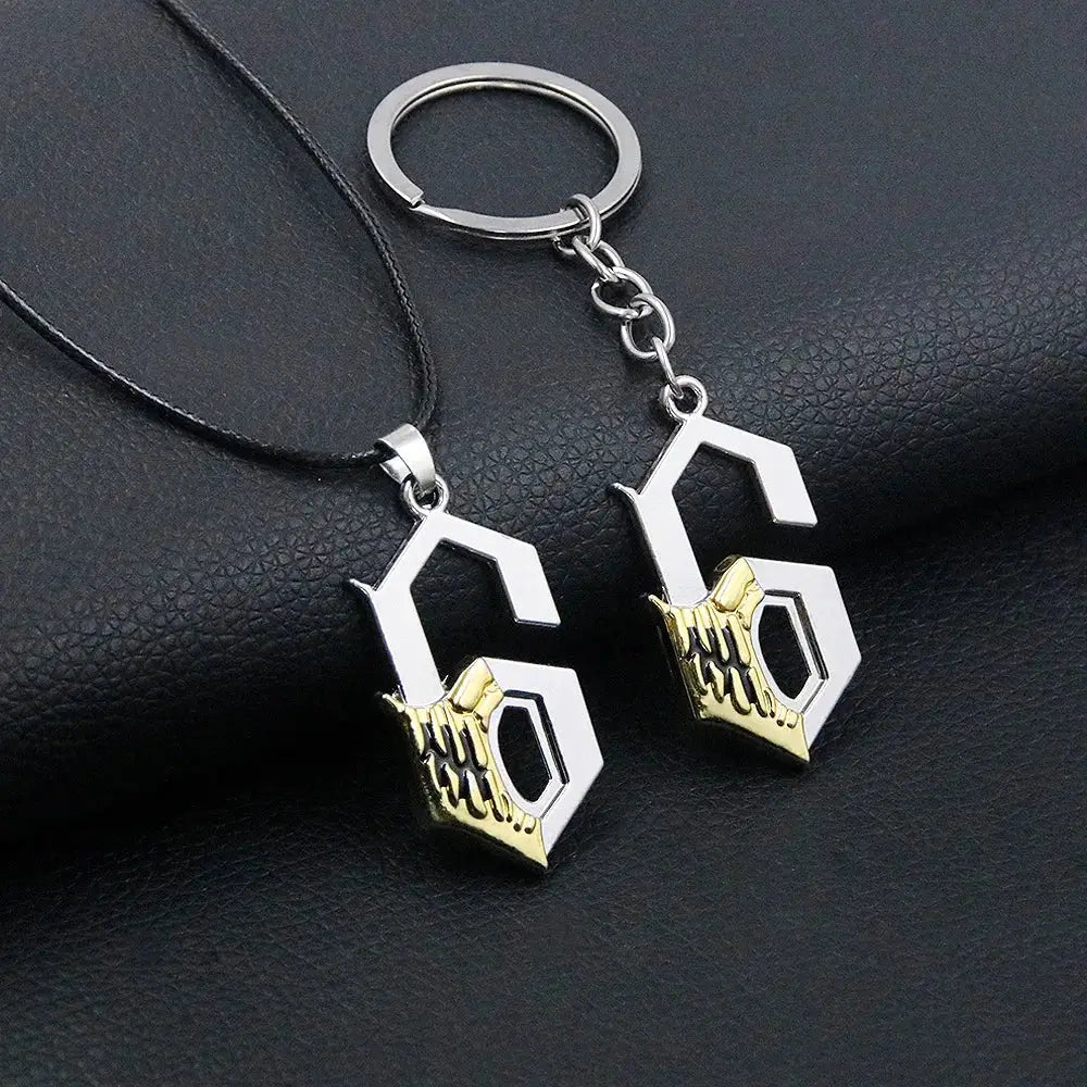 Silver and gold durable zinc alloy keychain featuring a stylized g with intricate hand design for bleach mask necklace cosplay accessory