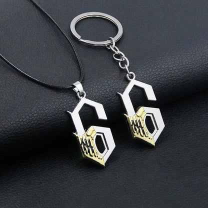 Silver and gold durable zinc alloy keychain featuring a stylized g with intricate hand design for bleach mask necklace cosplay accessory
