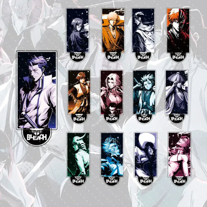 Set of ten colorful bleach anime character acrylic pins with black branding paired with a compact 15cm ichigo and orihime acrylic stand figure