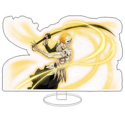 Translucent acrylic keychain standee featuring orange haired ichigo with white skull mask wielding sword and golden energy