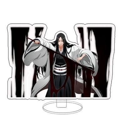 White and black acrylic keychain standee featuring bleach anime character in flowing robe holding staff with dark liquid dripping