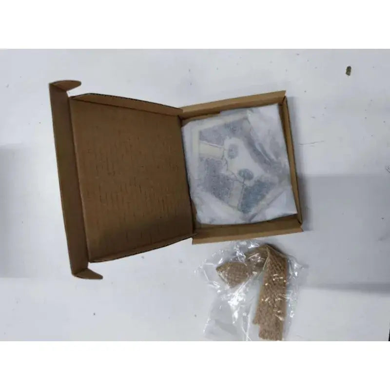 A beige textured fabric ichigo soul reaper cosplay badge with hemp rope strap wrapped in clear plastic beside a box