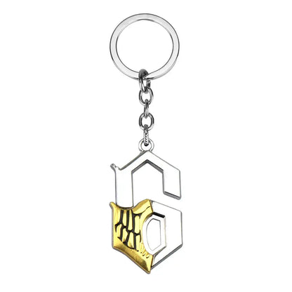 Silver and gold keychain pendant featuring stylized s with skeletal hand design for bleach ishida uryuu cosplay charm