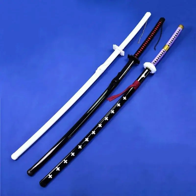Three stylized kurosaki ichigo katana swords with glossy black white and purple handles featuring cross patterns and accents