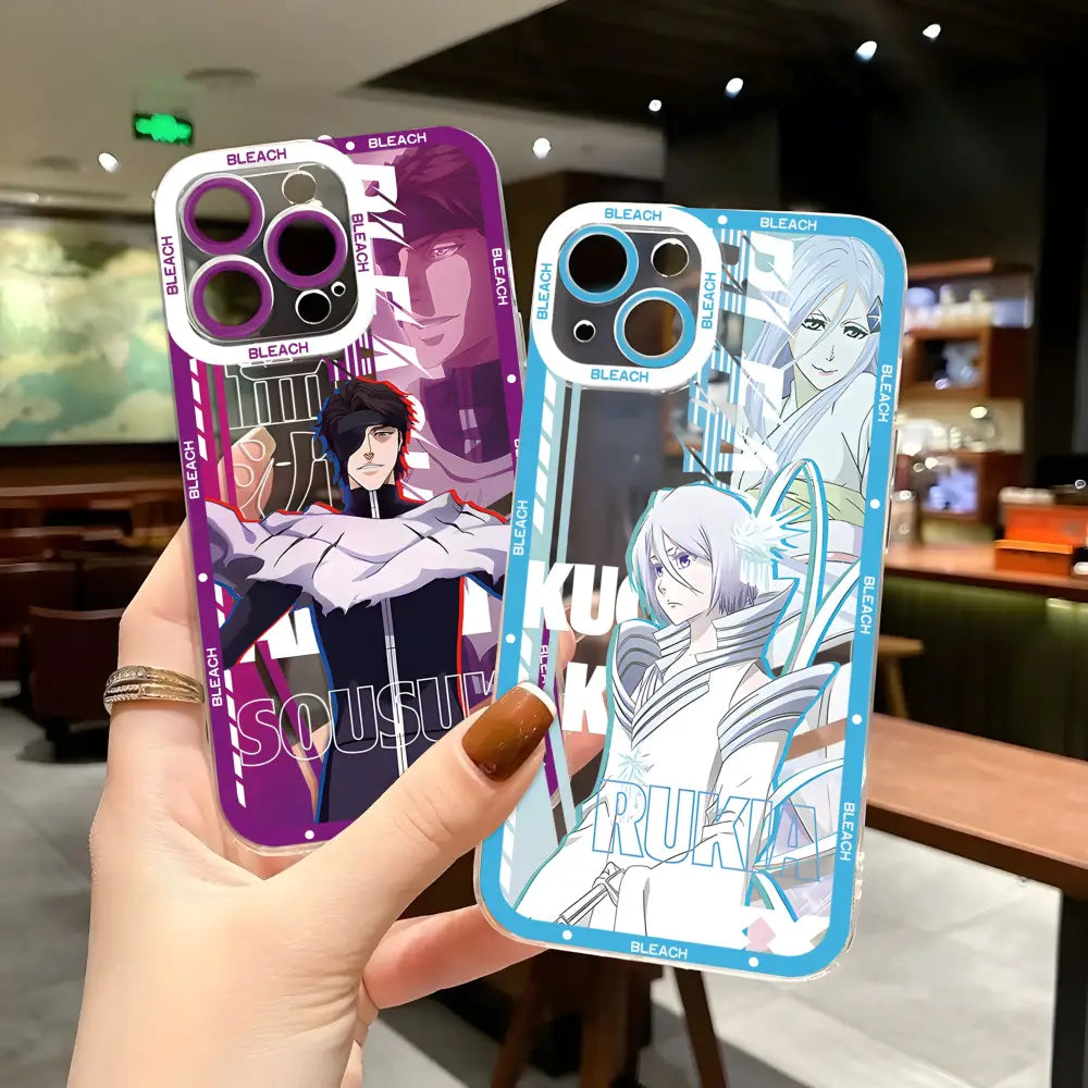 Two translucent bleach kurosaki ichigo phone cases with purple and blue anime designs on transparent backs