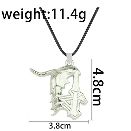 Silver metallic ulquiorra cifer metal pendant featuring intricate stylized d design with black cord keychain accessory