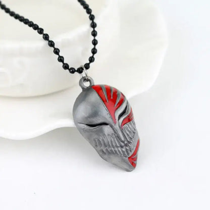 Silver and red enamel metal ulquiorra cifer mask pendant necklace with black beaded chain for bleach fans