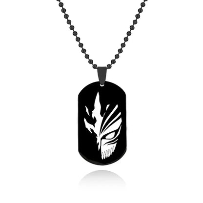 Black metal ulquiorra cifer mask keychain necklace with white stylized face and sharp angular teeth design