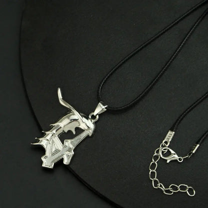 Silver metallic ulquiorra cifer mask pendant with angular bat wing design on black cord for keychain use