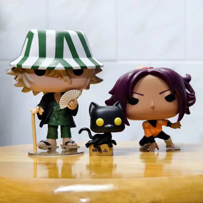 Green and white striped hat-wearing urahara kisuke funko pop figure in green outfit holding fan from bleach pvc figures