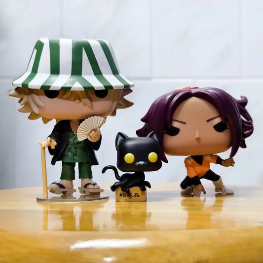 Green and white striped hat-wearing urahara kisuke funko pop figure in green outfit holding fan from bleach pvc figures