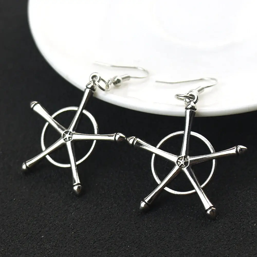 Silver star-shaped earrings with circular center and metallic finish paired with bleach uryuu ishida alloy choker necklace