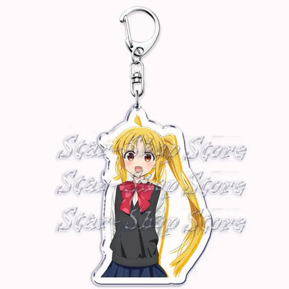 Clear acrylic keychain featuring hitori gotoh anime girl with blonde pigtails in black school uniform and red bow tie