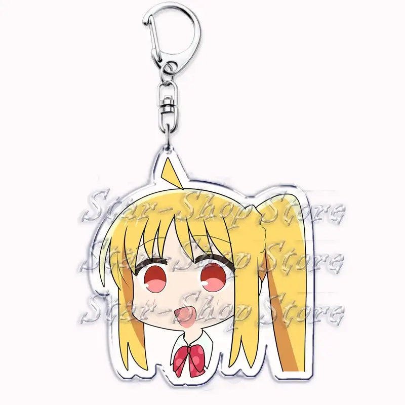 Clear acrylic keychain featuring chibi hitori gotoh with blonde pigtails red eyes and white shirt with pink bow